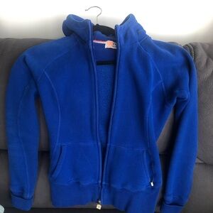 Royal Blue TNA zip hoodie.